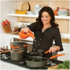 Rachael Ray Hard Anodized II Cookware Set W/ Orange Handles: 10pc -Kitchen Store rachael ray evoo bottles in use kitchen setting compressed 6 1