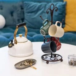 Le Creuset 1.7 Qt. Whistling Kettle | Noel (White & Gold) -Kitchen Store rippled lifestyle squares 0023 dsc0055 4