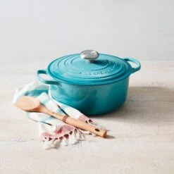 Le Creuset 5.5 Qt. Round Signature Cast Iron Dutch Oven With Stainless Steel Knob | Caribbean Blue 13 Le Creuset 5.5 Qt. Round Signature Cast Iron Dutch Oven With Stainless Steel Knob | Caribbean Blue -Kitchen Store rs14418 rs8350 180319 lca caribbean rdo 016 soft sunlight ss