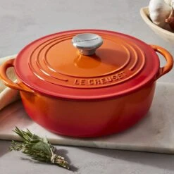 Le Creuset 2.75 Qt. Shallow Round Dutch Oven | Flame -Kitchen Store rs18381 221017 lecreuset flameclassicshallowrdo herbs horiz ret